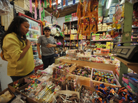 A person shops for chocolate skulls inside a market in the municipality of San Juan del Rio. Local market vendors offer items to decorate th...