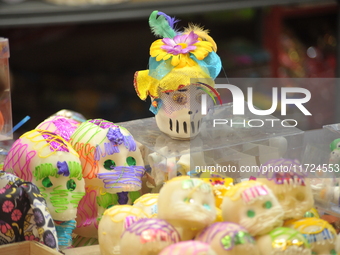 Sugar skulls, known as calaverita de azucar, are seen at a stand inside a market in the municipality of San Juan del Rio. Local market vendo...