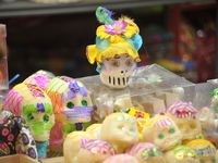 Sugar skulls, known as calaverita de azucar, are seen at a stand inside a market in the municipality of San Juan del Rio. Local market vendo...