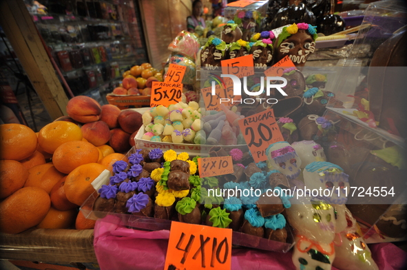 Sugar skulls, known as calaverita de azucar, are seen at a stand inside a market in the municipality of San Juan del Rio. Local market vendo...