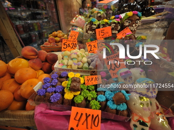 Sugar skulls, known as calaverita de azucar, are seen at a stand inside a market in the municipality of San Juan del Rio. Local market vendo...