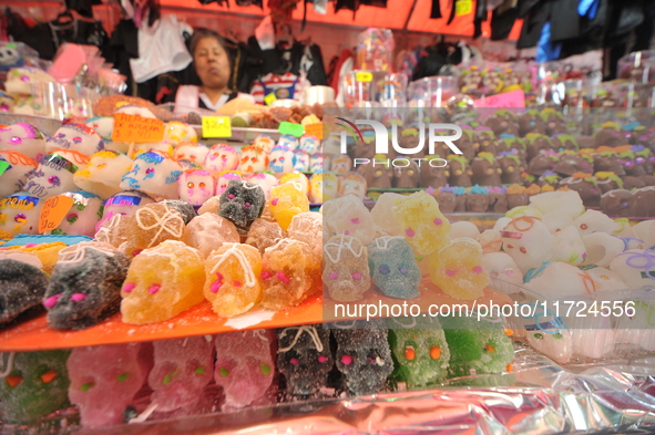 Sugar skulls, known as calaverita de azucar, are seen at a stand inside a market in the municipality of San Juan del Rio. Local market vendo...