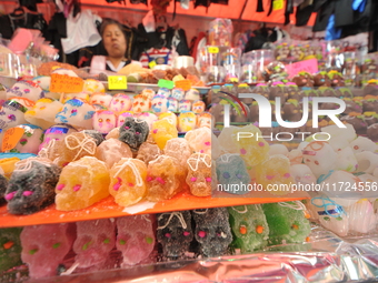 Sugar skulls, known as calaverita de azucar, are seen at a stand inside a market in the municipality of San Juan del Rio. Local market vendo...