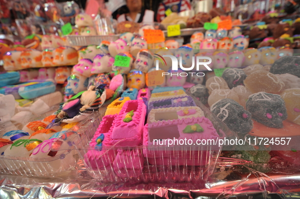 Sugar skulls, known as calaverita de azucar, are seen at a stand inside a market in the municipality of San Juan del Rio. Local market vendo...