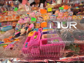 Sugar skulls, known as calaverita de azucar, are seen at a stand inside a market in the municipality of San Juan del Rio. Local market vendo...