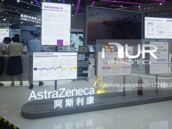 Visitors visit the stand of AstraZeneca in Hangzhou, China, on October 30, 2024. (