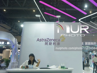 Visitors visit the stand of AstraZeneca in Hangzhou, China, on October 30, 2024. (