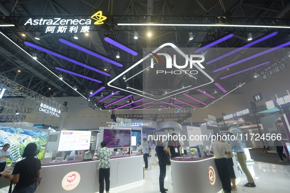 Visitors visit the stand of AstraZeneca in Hangzhou, China, on October 30, 2024. 