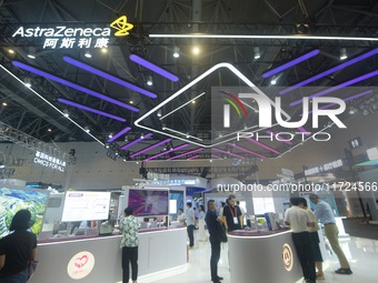 Visitors visit the stand of AstraZeneca in Hangzhou, China, on October 30, 2024. (