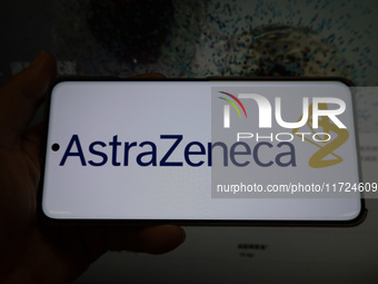 The corporate logo and official website of AstraZeneca are displayed in Shanghai, China, on October 31, 2024. (