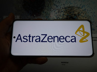 The corporate logo and official website of AstraZeneca are displayed in Shanghai, China, on October 31, 2024. (