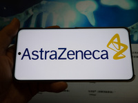 The corporate logo and official website of AstraZeneca are displayed in Shanghai, China, on October 31, 2024. (