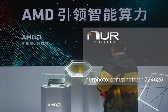 Visitors visit the booth of AMD at the 6th CIIE in Shanghai, China, on November 6, 2023. 