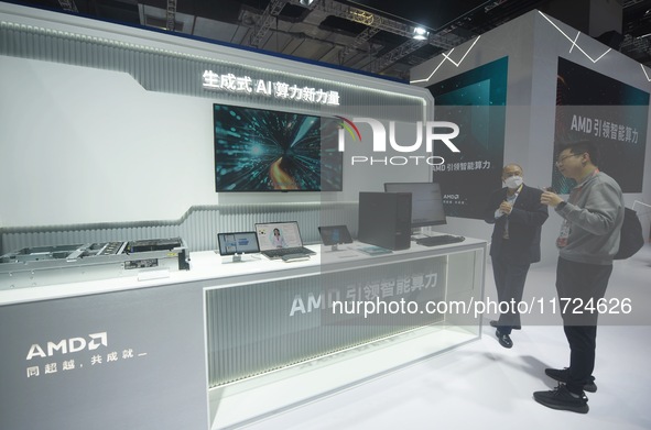 Visitors visit the booth of AMD at the 6th CIIE in Shanghai, China, on November 6, 2023. 