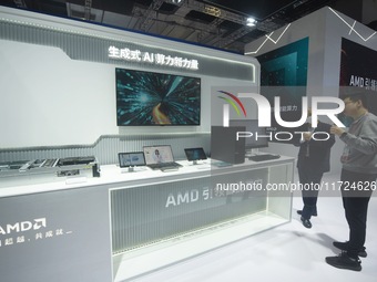 Visitors visit the booth of AMD at the 6th CIIE in Shanghai, China, on November 6, 2023. (