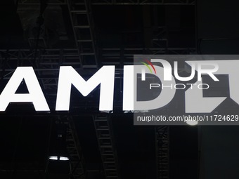 Visitors visit the booth of AMD at the 6th CIIE in Shanghai, China, on November 6, 2023. (