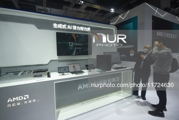 Visitors visit the booth of AMD at the 6th CIIE in Shanghai, China, on November 6, 2023. 