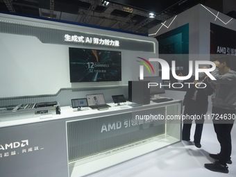 Visitors visit the booth of AMD at the 6th CIIE in Shanghai, China, on November 6, 2023. (