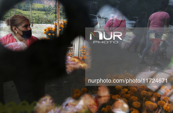 Women sell Cempasuchil flowers in the Tlahuac municipality in Mexico City, Mexico, on October 30, 2024, for the Day of the Dead on November...