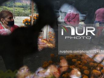 Women sell Cempasuchil flowers in the Tlahuac municipality in Mexico City, Mexico, on October 30, 2024, for the Day of the Dead on November...