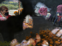 Women sell Cempasuchil flowers in the Tlahuac municipality in Mexico City, Mexico, on October 30, 2024, for the Day of the Dead on November...