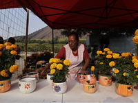 Women sell Cempasuchil flowers in the Tlahuac municipality in Mexico City, Mexico, on October 30, 2024, for the Day of the Dead on November...