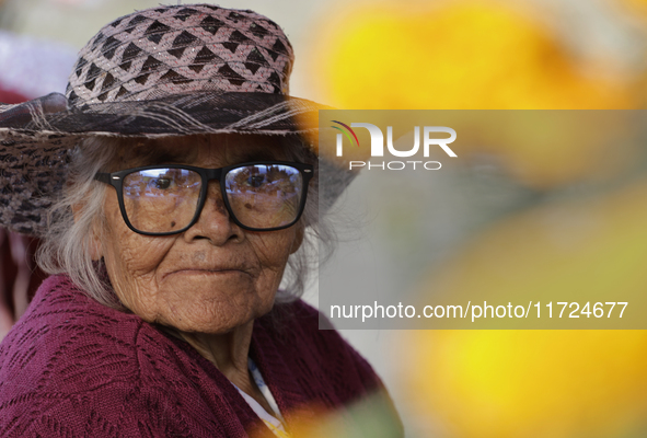 Women sell Cempasuchil flowers in the Tlahuac municipality in Mexico City, Mexico, on October 30, 2024, for the Day of the Dead on November...