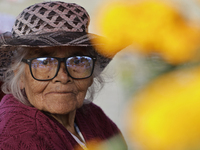 Women sell Cempasuchil flowers in the Tlahuac municipality in Mexico City, Mexico, on October 30, 2024, for the Day of the Dead on November...