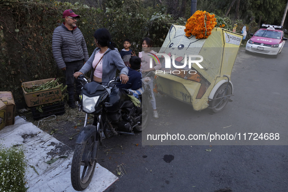 People attend a store to buy Cempasuchil flowers in the Tlahuac municipality in Mexico City, Mexico, on October 30, 2024, for the Day of the...