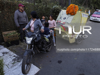 People attend a store to buy Cempasuchil flowers in the Tlahuac municipality in Mexico City, Mexico, on October 30, 2024, for the Day of the...