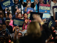 Young girls react to Vice President Kamala Harris as she waves to the crowd during a get out the vote rally in Harrisburg, PA, on October 30...