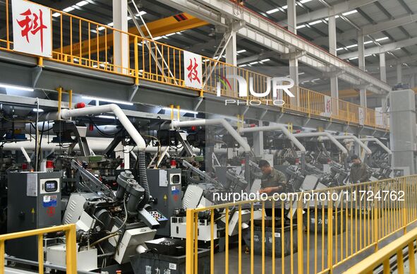 A worker produces drill tail wire for export overseas in a digital intelligent production workshop at a hardware manufacturing company in Ha...