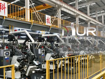 A worker produces drill tail wire for export overseas in a digital intelligent production workshop at a hardware manufacturing company in Ha...