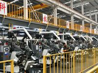 A worker produces drill tail wire for export overseas in a digital intelligent production workshop at a hardware manufacturing company in Ha...