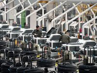 A worker checks equipment operation at a digital intelligent production workshop at a hardware manufacturing company in Handan, China, on Oc...