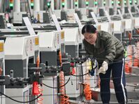 A worker works in a digital intelligent production workshop at a hardware manufacturing company in Handan, China, on October 30, 2024. (