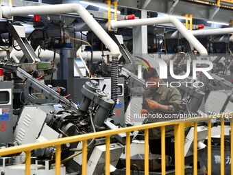 A worker produces drill tail wire for export overseas in a digital intelligent production workshop at a hardware manufacturing company in Ha...