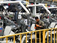 A worker produces drill tail wire for export overseas in a digital intelligent production workshop at a hardware manufacturing company in Ha...