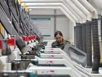 A worker works in a digital intelligent production workshop at a hardware manufacturing company in Handan, China, on October 30, 2024. (