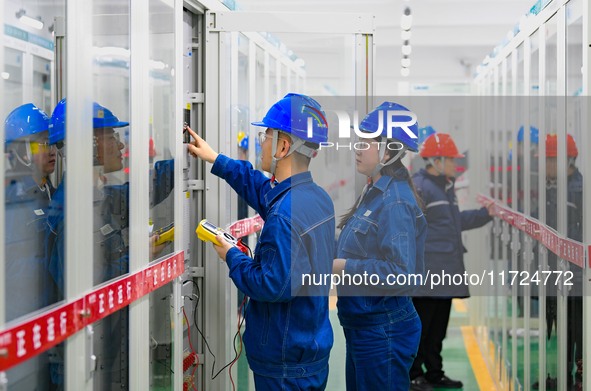 Operation and maintenance personnel work at the Shengli Substation of the Zhangbei-Shengli 1000kV UHV AC project in Xilingol League, Inner M...