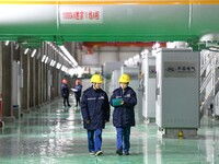 Operation and maintenance personnel check transmission equipment at the Shengli Substation of the Zhangbei-Shengli 1000kV UHV AC project in...