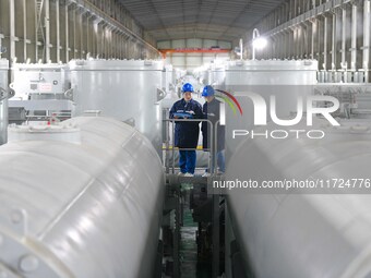 Operation and maintenance personnel check transmission equipment at the Shengli Substation of the Zhangbei-Shengli 1000kV UHV AC project in...