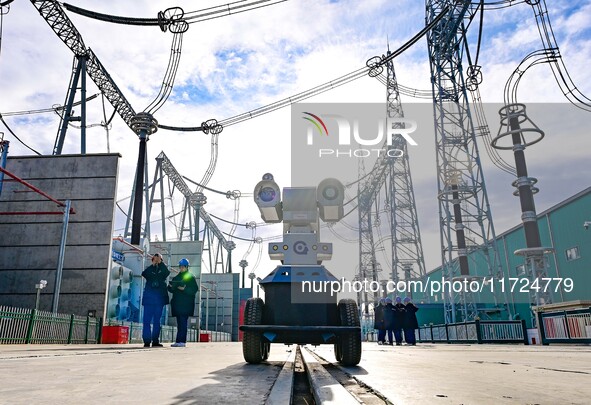 Operation and maintenance personnel check transmission equipment at the Shengli Substation of the Zhangbei-Shengli 1000kV UHV AC project in...