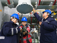 Operation and maintenance personnel record the operation parameters of transmission equipment at the Shengli Substation of the Zhangbei-Shen...