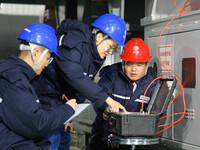 Operation and maintenance personnel record the operation parameters of transmission equipment at the Shengli Substation of the Zhangbei-Shen...