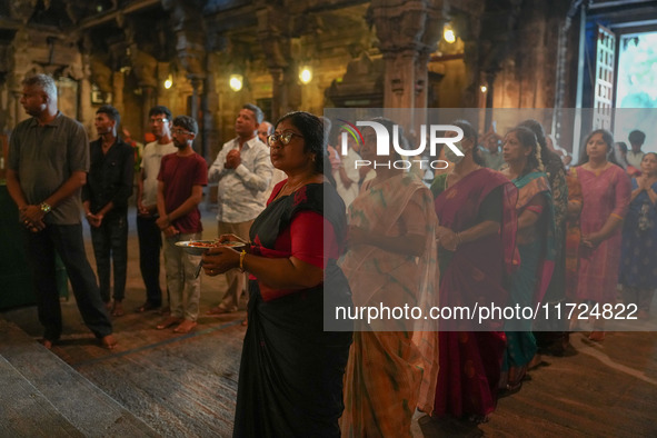 Hindu devotees pray and offer for Diwali at the Sri Ponnambala Vaneswarar Hindu temple in Colombo, Sri Lanka, on October 31, 2024. Diwali, o...