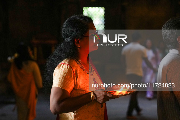 A Hindu devotee offers a prayer for Diwali at the Sri Ponnambala Vaneswarar Hindu temple in Colombo, Sri Lanka, on October 31, 2024. Diwali,...