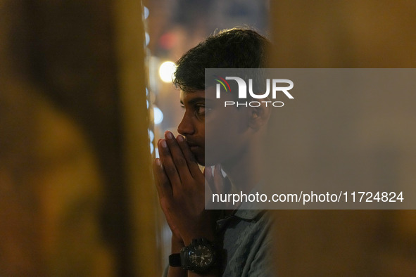 A Hindu devotee offers a prayer for Diwali at the Sri Ponnambala Vaneswarar Hindu temple in Colombo, Sri Lanka, on October 31, 2024. Diwali,...