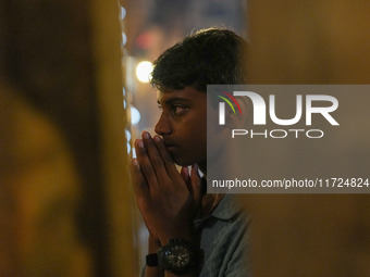 A Hindu devotee offers a prayer for Diwali at the Sri Ponnambala Vaneswarar Hindu temple in Colombo, Sri Lanka, on October 31, 2024. Diwali,...