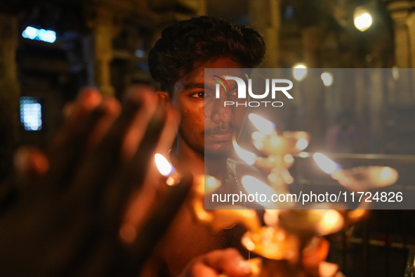 A Hindu devotee offers a prayer for Diwali at the Sri Ponnambala Vaneswarar Hindu temple in Colombo, Sri Lanka, on October 31, 2024. Diwali,...